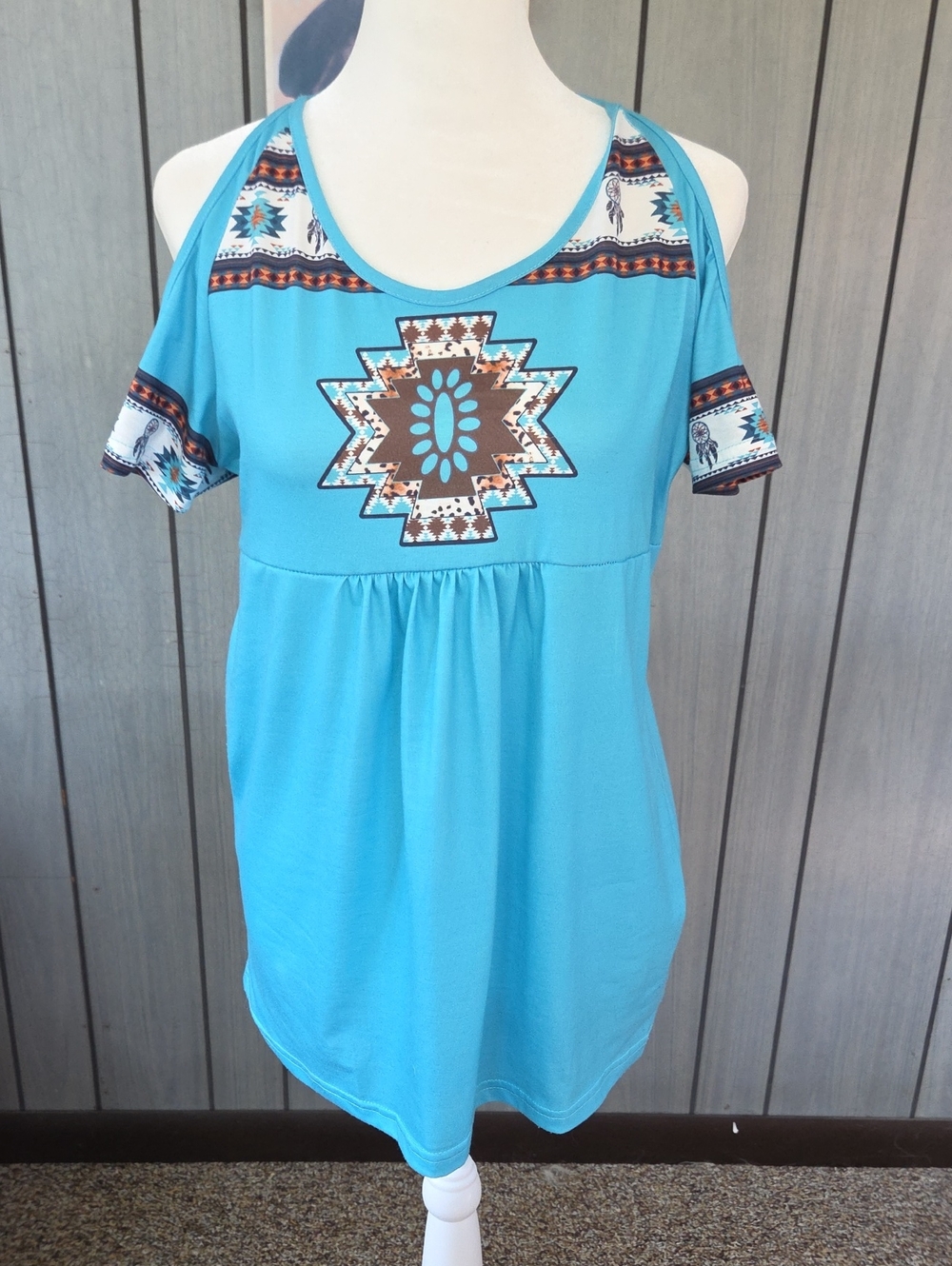 Turquoise cold-shoulder tribal print women’s top
